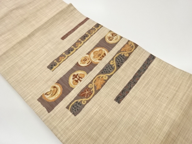 変わり横段に丸文・花鳥・葡萄唐草模様織出し名古屋帯